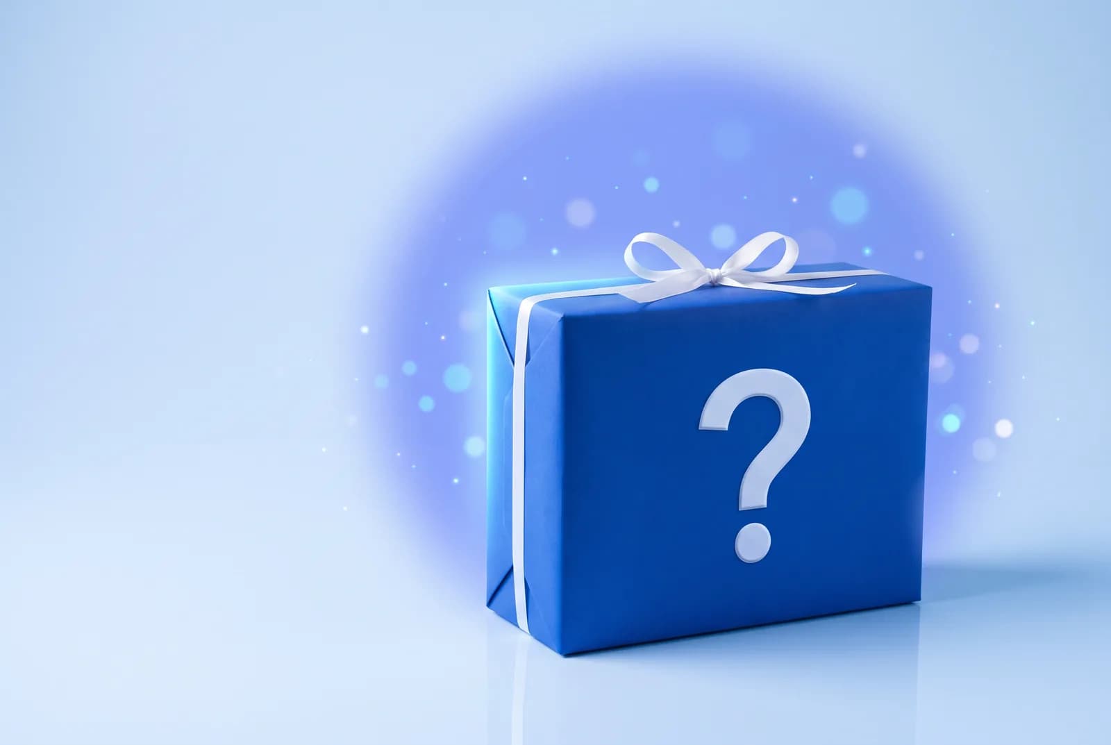Illustration: mystery box wrapped in blue paper with a question mark